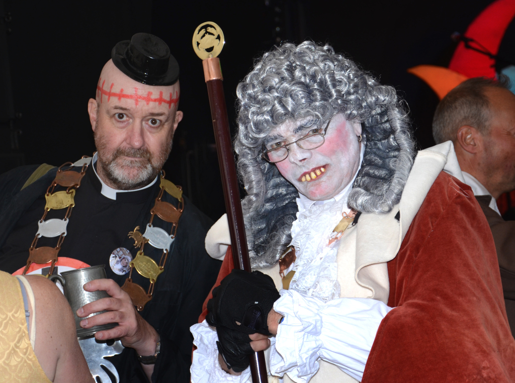 Golowan Festival Mock Mayor ceremony with Lord Justice Socks overseeing costumed candidates on stage in Penzance, Cornwall.